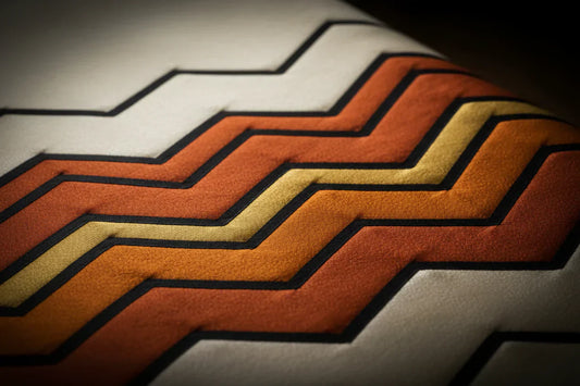 PYDAXA Inlay™ — wave pattern in ivory, terracotta and gold master silk, precision hand-cut construction — PYDAXA
