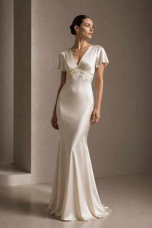 Front portrait of the PYDAXA Axis Inlay Gown in Ivory Light constructed from structured matte satin with a sculpted mermaid silhouette, featuring precision PYDAXA Inlay™ integrated directly into the waist structure to control the line with restrained architectural elegance and fluid couture balance.